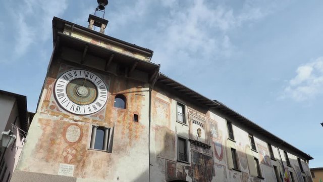 Clusone, Bergamo, Italy. The astronomical or planetary clock and the facade of the town hall. Famous attraction of the city. It has been loaded by hand every day for about four hundred years