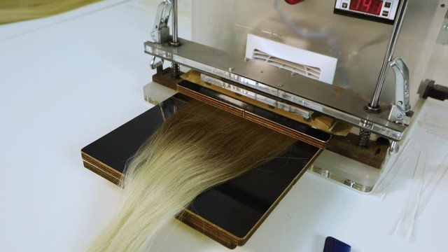 False hair. Hair for hair extension. Hair production for extension