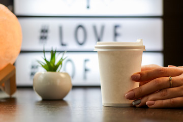 hand with cup of coffee
