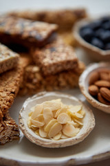 Close up of Almond petals. With various energy nutrition bars in background