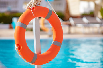 life buoy close-up on pool background with blurry background