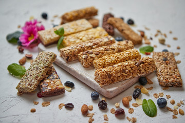 Various kinds of protein granola bars with dry fruits and berries