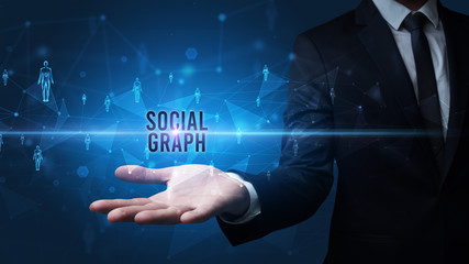 Elegant hand holding SOCIAL GRAPH inscription, social networking concept