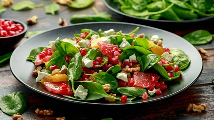  Orange Grapefruit salad with spinach, walnuts, pomegranate seeds and feta cheese. healthy food © grinchh