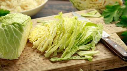 Fresh Slice of Cabbage on wooden chopping board. healthy food