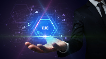 Man hand holding VLOG inscription, social media concept