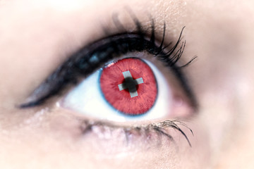 Flag of Switzerland reflects in a woman blue eye - election, sport, hope, young, generation, pride, dream, emotion, independance	