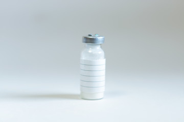 Glass bottle with medicine. On the strip label.