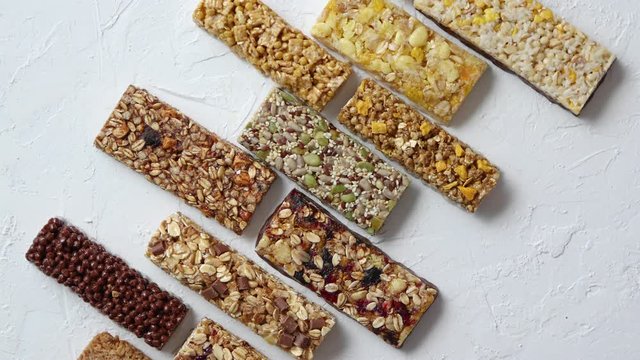 Row of mixed gluten free granola cereal energy bars. With dried fruits and nuts.