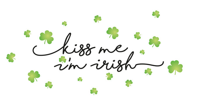 Kiss me I'm Irish handwritten typography with flying green clovers isolated white background