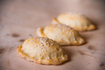 Panzerotti on a wooden table Closeup