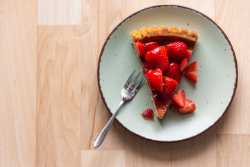 a piece of fresh strawberry cake on a decorative plate
