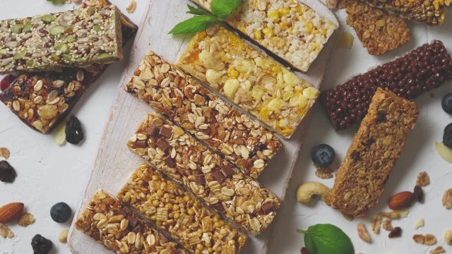 Various kinds of protein granola bars with dry fruits and berries