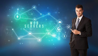 Businessman in front of cloud service icons with WEB SERVERS inscription, modern technology concept