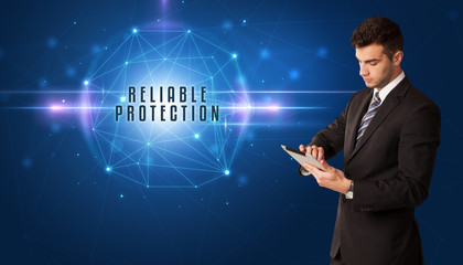 Businessman thinking about security solutions with RELIABLE PROTECTION inscription