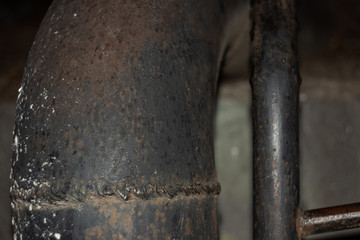 Weld on the corner of an old pipe