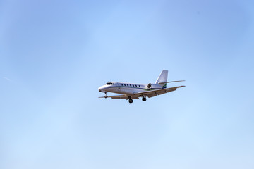 Executive jet is arriving at the airport. Travel by air, transportation.