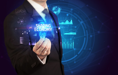 Businessman holding lightbulb with SHARING ECONOMY inscription, Business idea concept