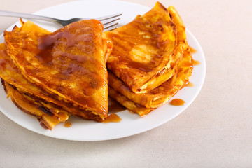 Crepes with caramel sauce, served