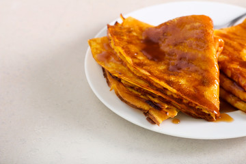 Crepes with caramel sauce, served