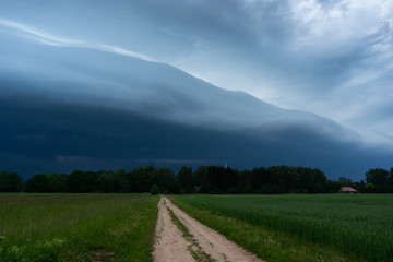 storm cloud over a countryside road
