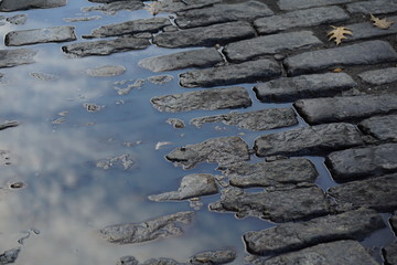 black road with water