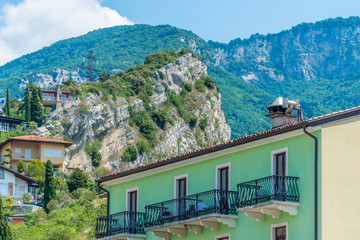 Fototapeta na wymiar Fragment of a colorful apartment building in Malcesine, Lake Garda, Italy.