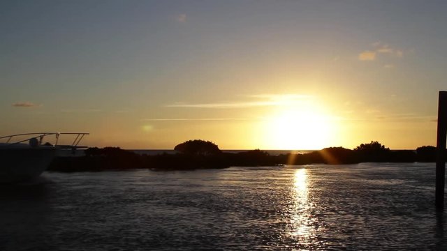 Fishing boat off to the deep sea on the sunrise