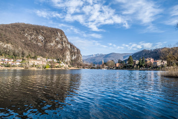 Mountains reflecting on the lake Lugano