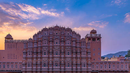 Fototapeta na wymiar Hawa Mahal, Jaipur, Rajasthan, India, a five-tier harem wing of the palace complex of the Maharaja of Jaipur, built of pink sandstone in the form of the crown of Krishna, Palace of the Winds
