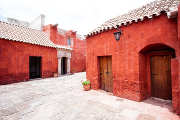 Courtyard in the monastery of Santa Catalina, Arequipa, Peru, along the walls in potted flowers.