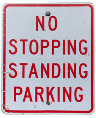 NO STOPPING STANDING PARKING sign isolated on white.