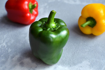 Multi-colored fresh bell peppers. Green, red and yellow vegetables. Organic healthy food concept
