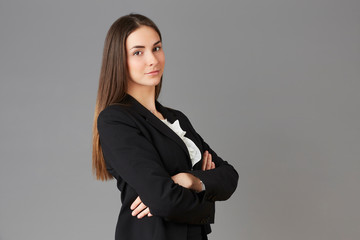 young businesswoman posing instudio background