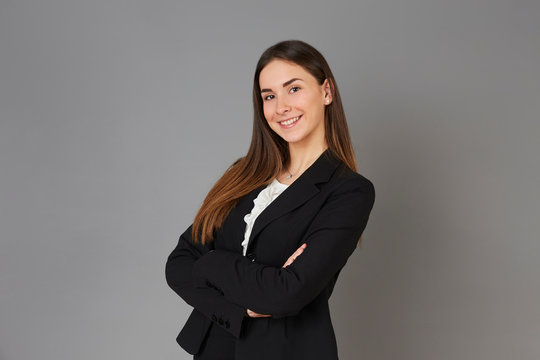 young businesswoman posing instudio background