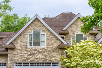 The top of the house or apartment building with nice window.
