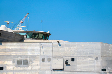 Nadvigation bridge deck of with watch officer with radar communication with antenna mast