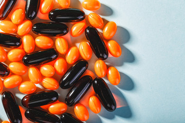 Colorful pills on a blue background.