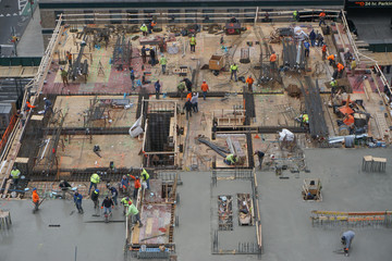 New York, New York: Aerial view of men and materials during the construction of a 42-story high-rise apartment building in midtown Manhattan, New York City.