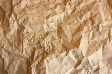 Brown crumpled paper texture.  Kraft paper background.