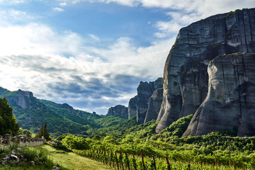 Amazing Meteora Monastery in Greece. Fantastic view at mountains and green forest against epic blue...