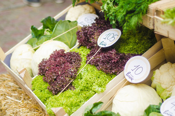 Various Fruits And Vegetables For Sale At Market Stall