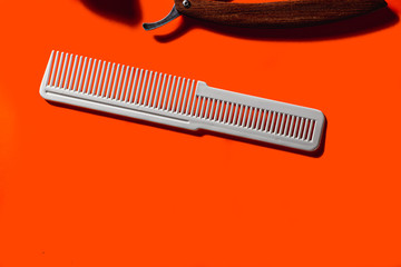 Old barber tools on an old beautiful Lush Lava surface. A part razor, comb, . horizontal orientation. copy space.