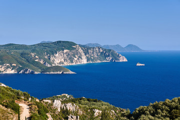 View to rocky peninsula and bay at Corfu island, Greece.