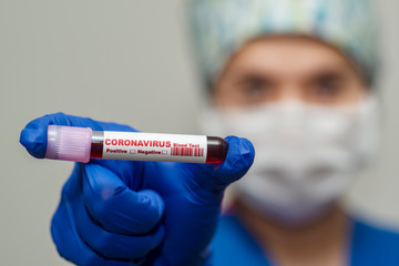 Nurse holding test tube with blood for 2019-nCoV analyzing.  Virus infection originating in Wuhan, China