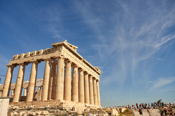 Fototapeta premium ATHENS, GREECE - 2019 May 18: Tourists in ancient ruins Parthenon Temple in a summer day in Acropolis Greece, Athens