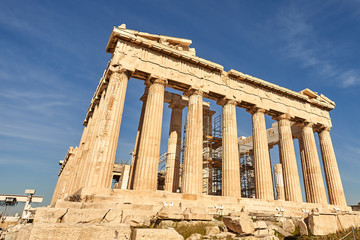 Fototapeta premium ATHENS, GREECE - 2019 May 18: Tourists in ancient ruins Parthenon Temple in a summer day in Acropolis Greece, Athens