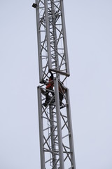 Fototapeta na wymiar Man at work building tower crane