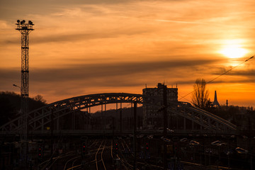 View of cityscape of Mulhouse in France with  railways and bridge silhouette by sunset