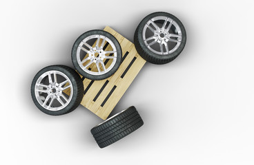 Top view of 4 Large Sport Wheels in chaos on a wood pallet